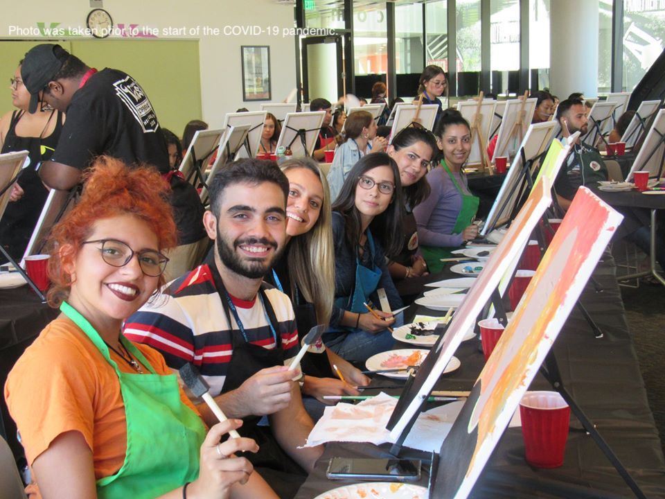 Students painting in a group 